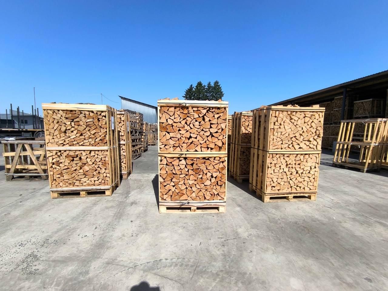 Crates of kiln-dried beech firewood on a loading yard