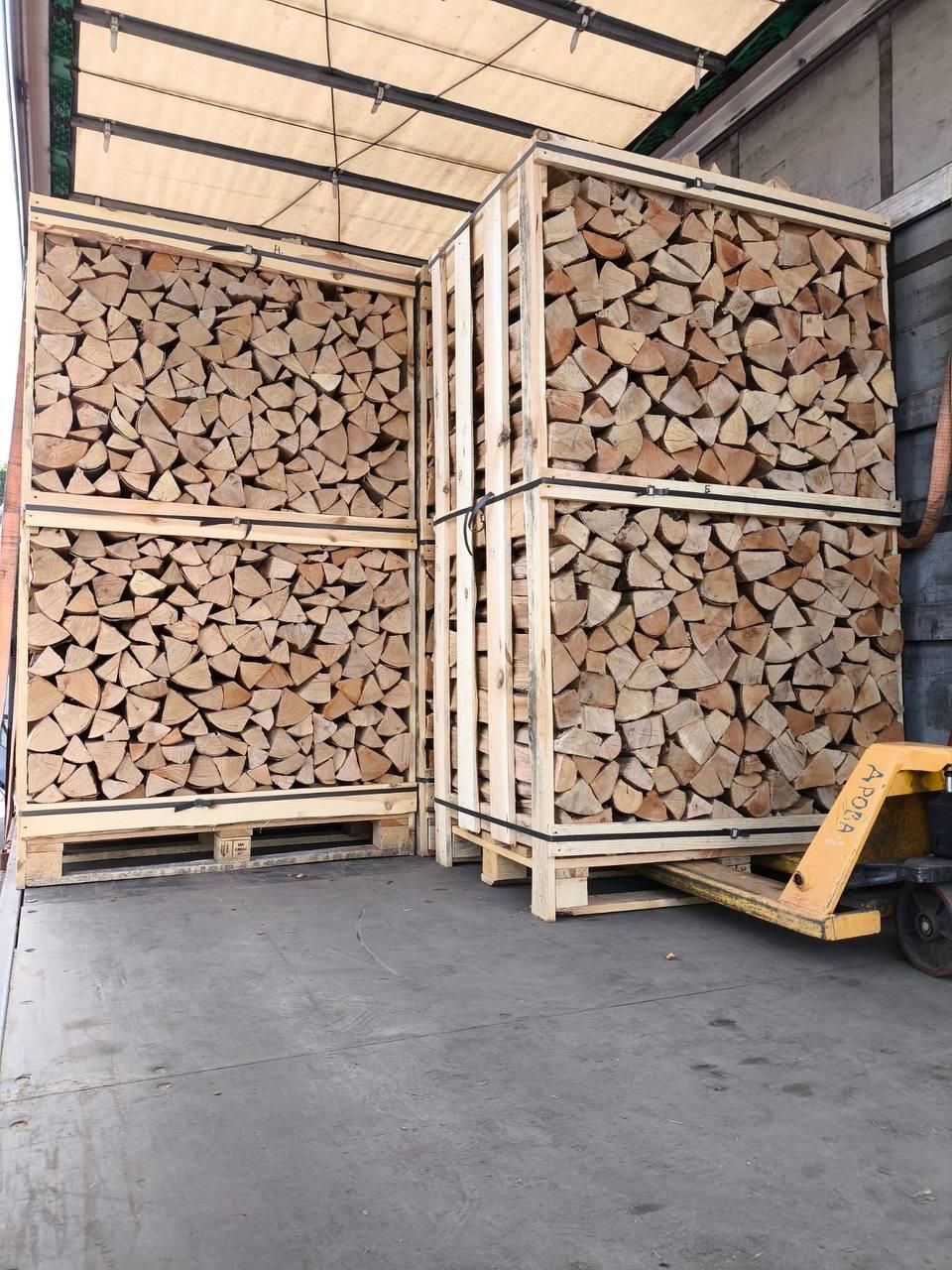 Firewood crates being loaded with a pallet truck
